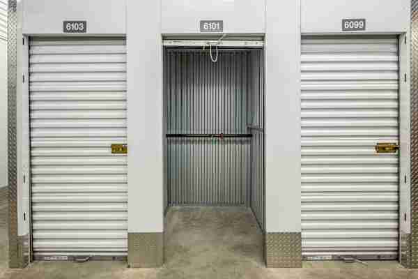 a row of climate controlled storage units with an open door at Manhattan Mini Storage Midtown