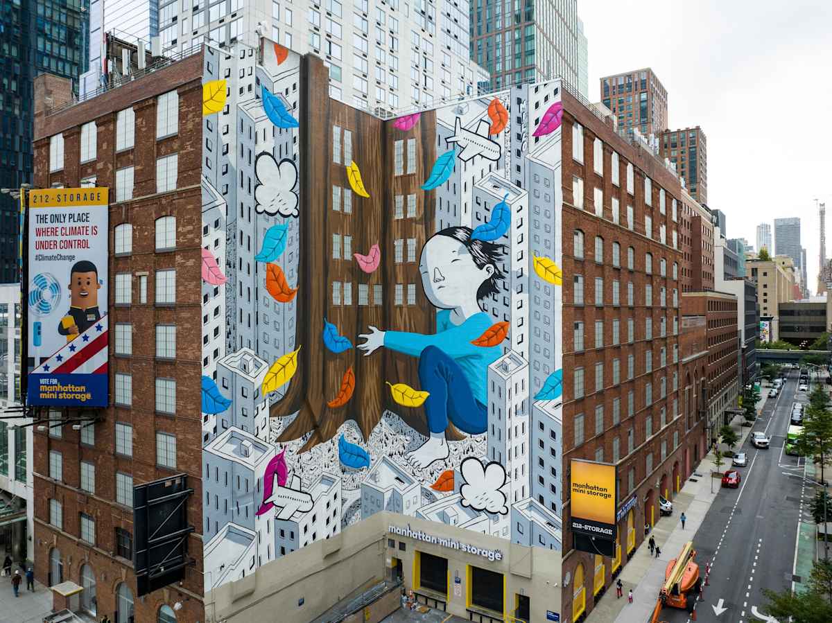 street view of Manhattan Mini Storage at 541 W 29th St with a bright colorful mural painted on the side of the building