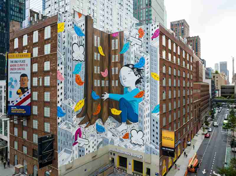 street view of Manhattan Mini Storage at 541 W 29th St with a bright colorful mural painted on the side of the building