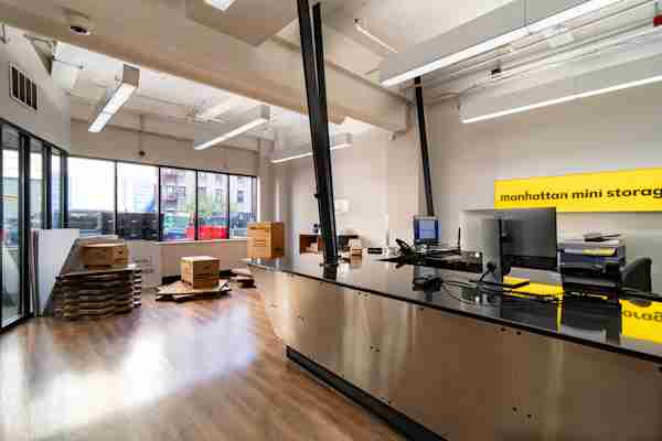 office of Manhattan Mini Storage on 570-571 Riverside Dr with a view of the front desk and a stack of moving boxes