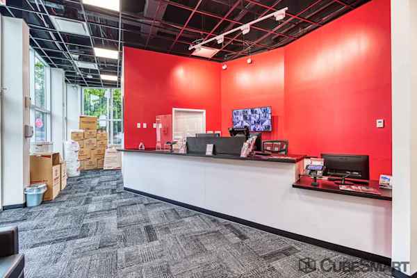 front office on Caton Place with a view of the desk and neat stacks of moving and packing supplies