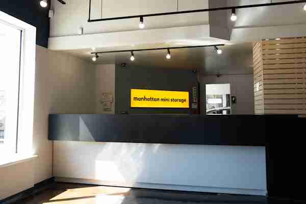 Manhattan Mini Storage on 4th and 38th front desk with logo sign