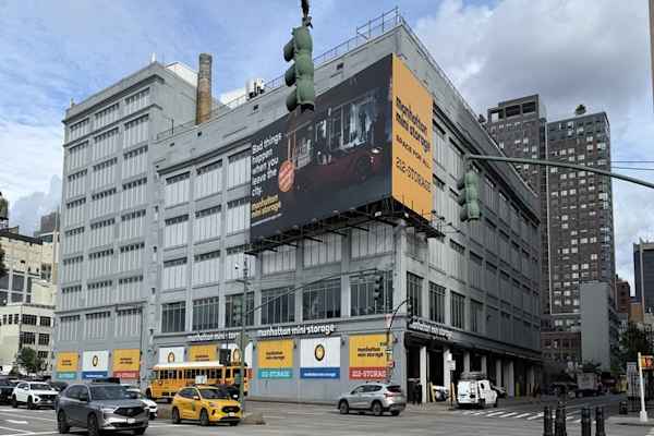 street view of Manhattan Mini Storage on W 44th St with a view of their Bad Things Happen when you leave the city billboard.