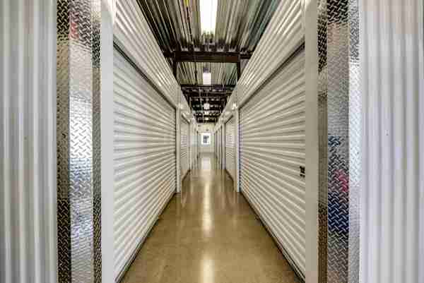 a well-lit row of climate controlled storage units at Manhattan Mini Storage near Union, NJ