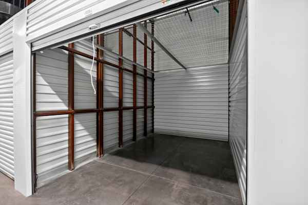 a self storage unit with the door open for an inside view at Manhattan Mini Storage