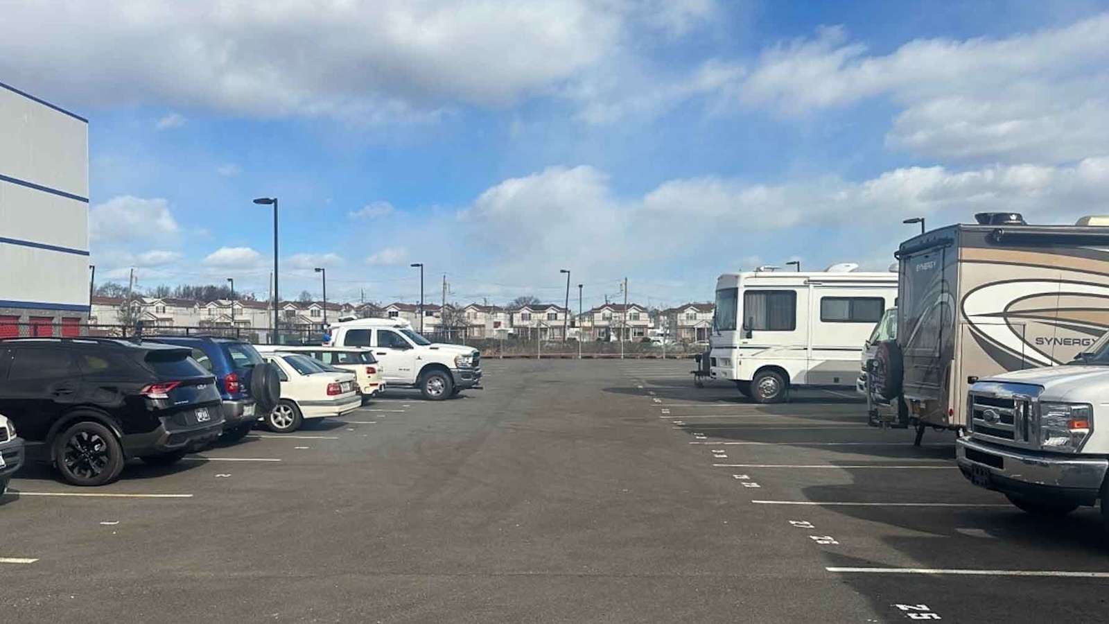cars parking in front of a Manhattan Mini Storage facility