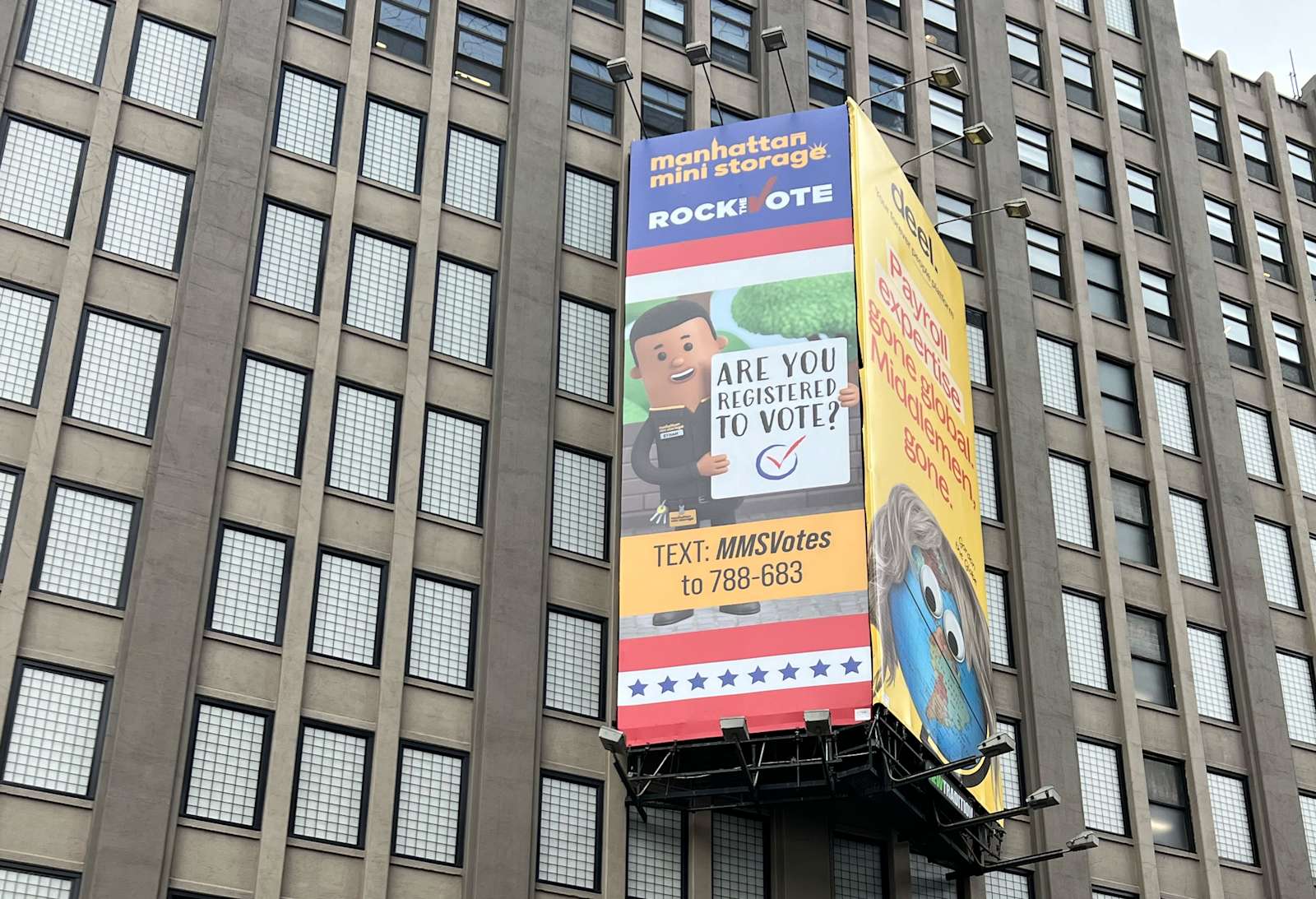 Billboard at Manhattan Mini Storage showing an Are You Registered to Vote sign