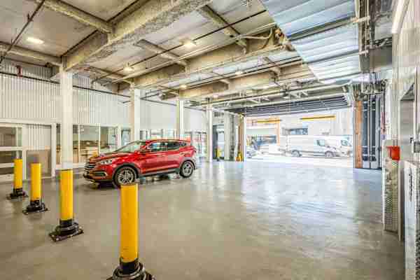 drive in loading bay with a car parked at Manhattan Mini Storage and a view onto W 47th Street