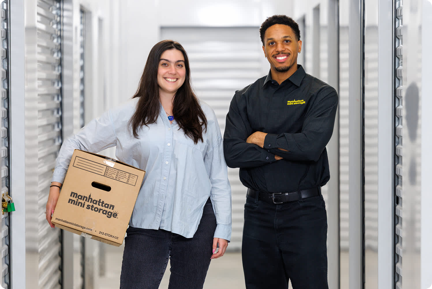 A Manhattan Mini Storage employee is smiling facing the camera