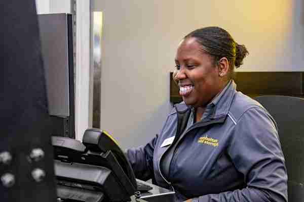 Smiling employee at Manhattan Mini Storage on 108-110 W 107th St