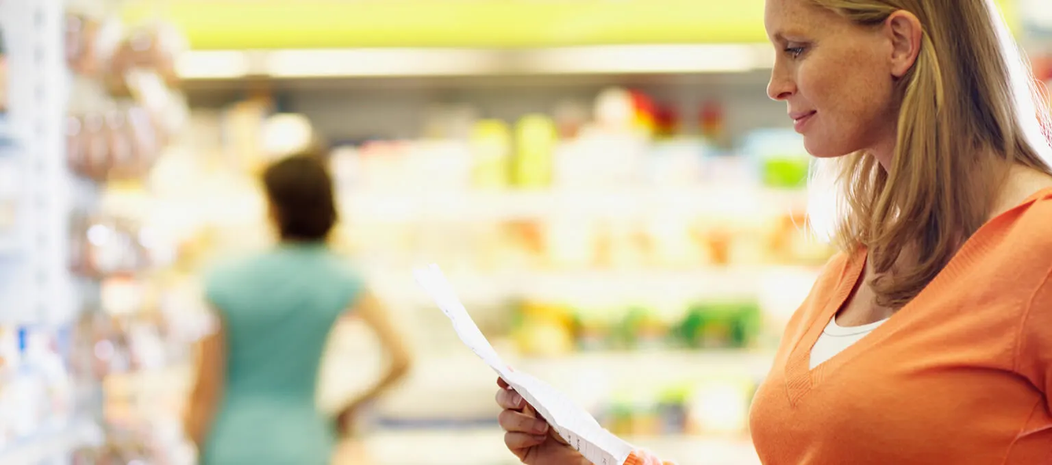 Pregnant woman is grocery shopping