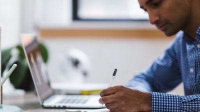 Man studies at laptop