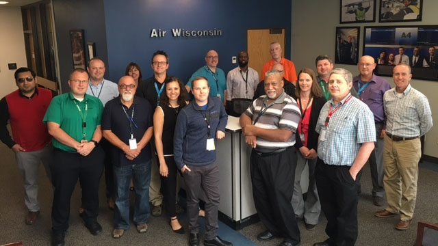 Corporate Employees group Photo around the front desk