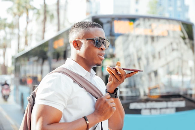 Young man on the streets of big city.Talking phone.