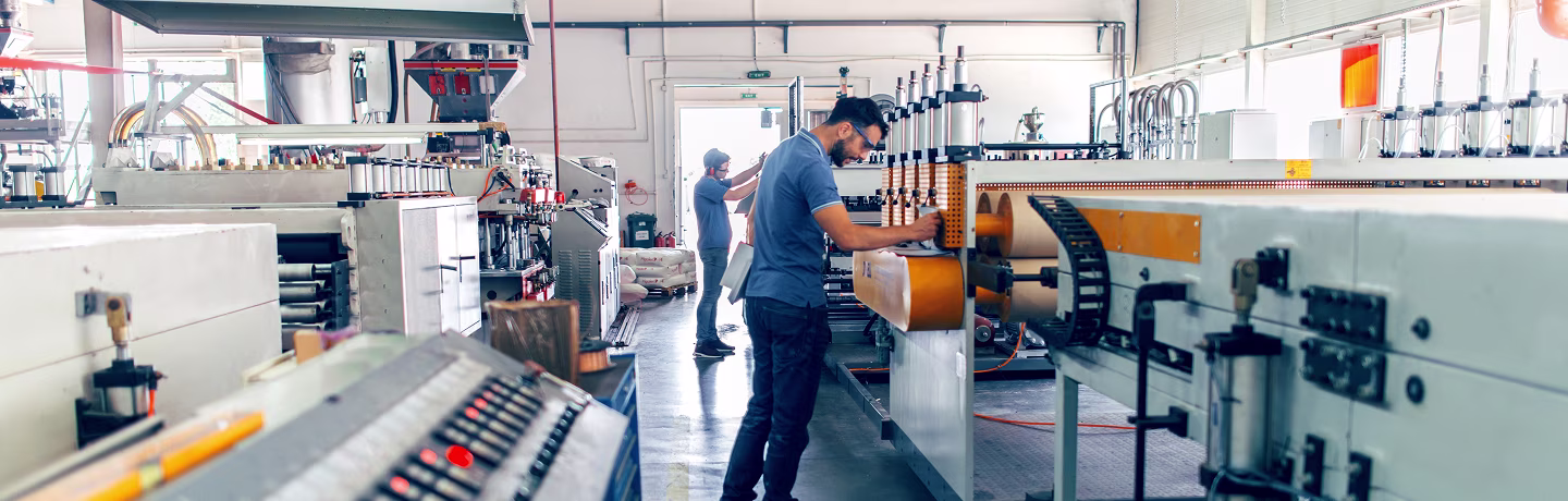 People at work. Industrial manufacture indoors.