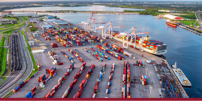 A fully loaded container ship in moored at the commercial docks of the Port of Tampa Bay located near downtown Tampa Florida shot via helicopter from an altitude of about 600 feet.