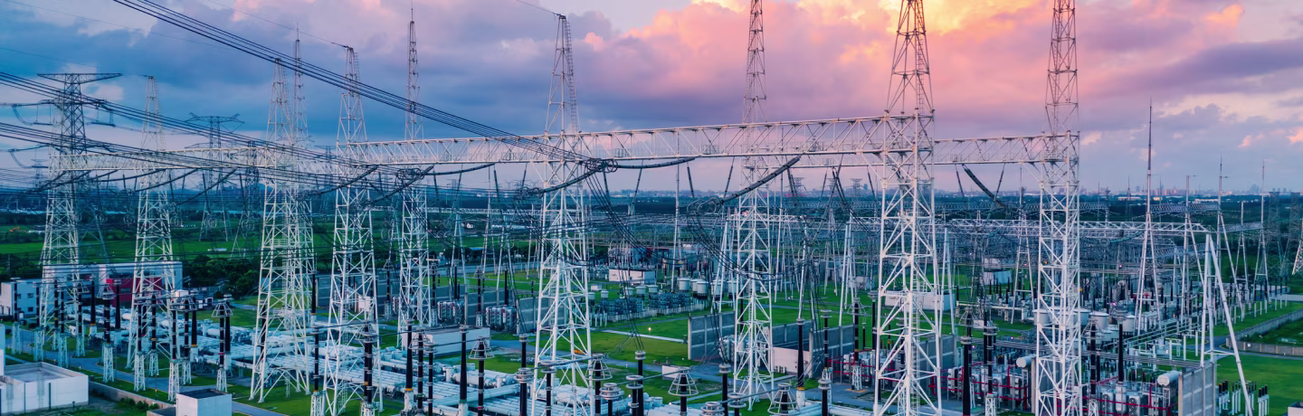 Aerial view of a high voltage substation. Industrial power tower background.
