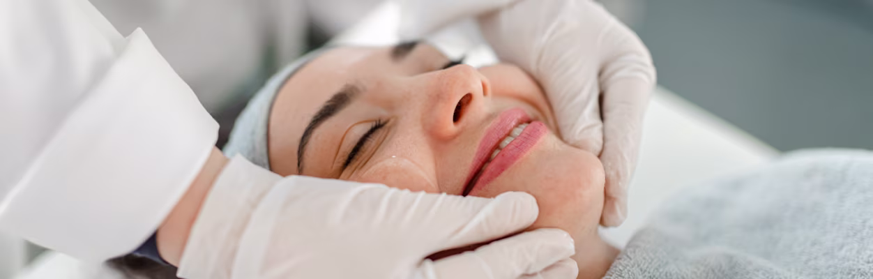 Happy woman receiving a beauty treatment/facial