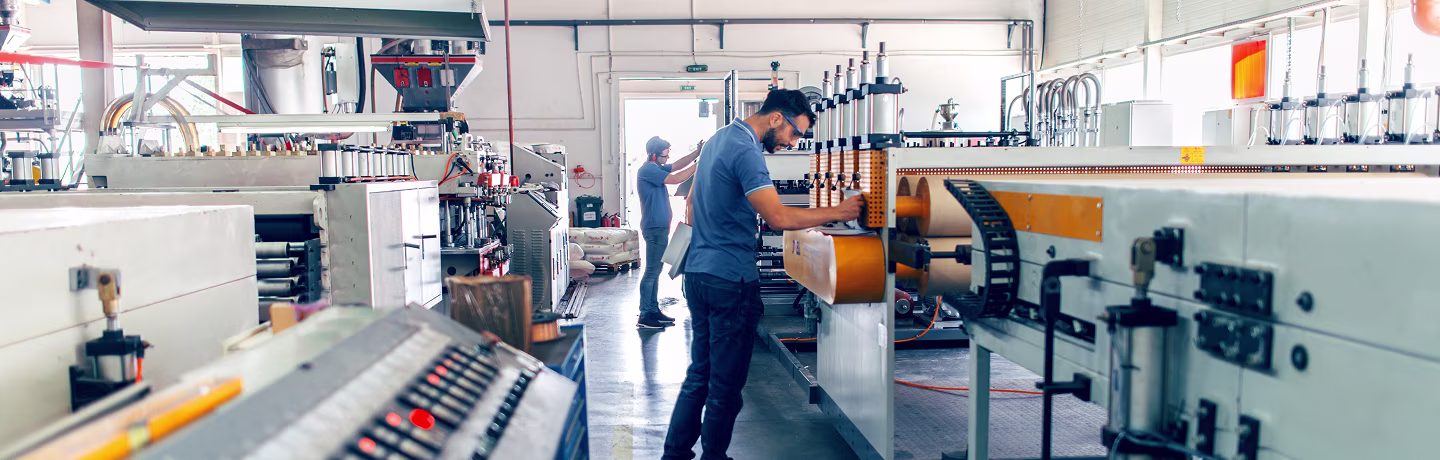 People at work. Industrial manufacture indoors.