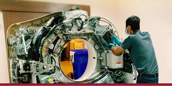 Close-up on an electrician fixing medical equipment at the hospital.