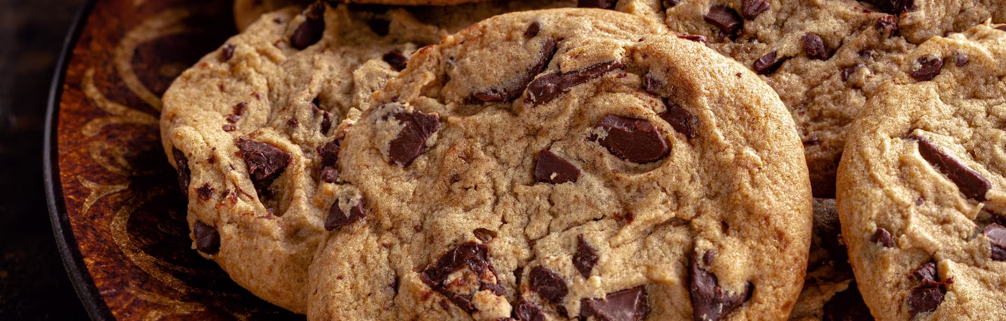 Closeup of chocolate chip cookies on a plate.