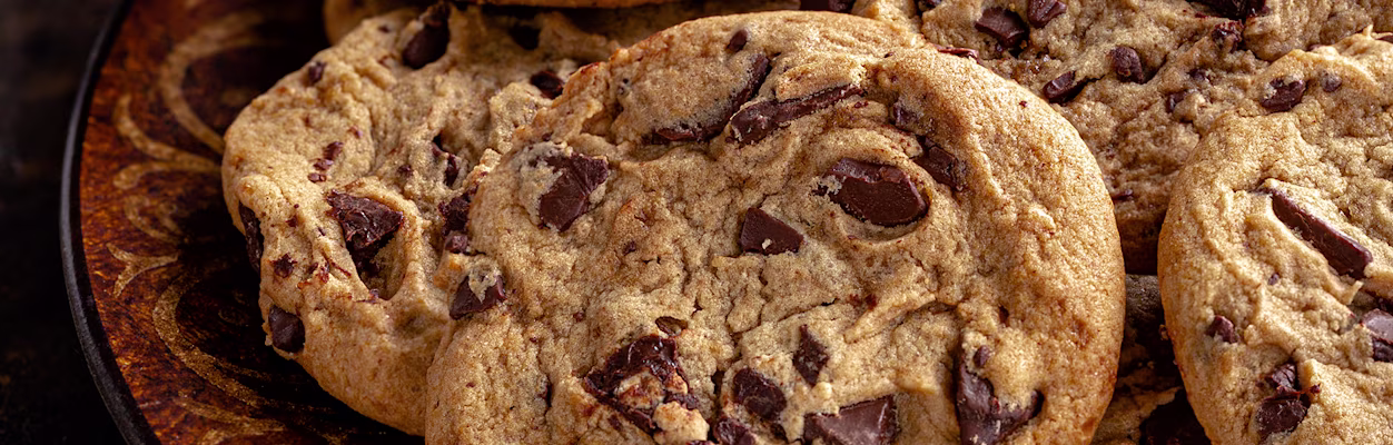 Closeup of chocolate chip cookies on a plate.