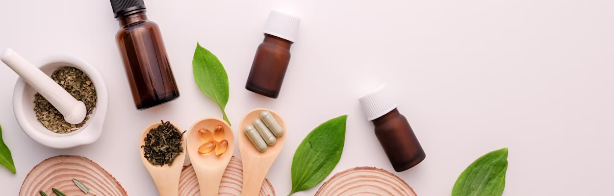 Cosmetic skin care bottles on vanity mirror.