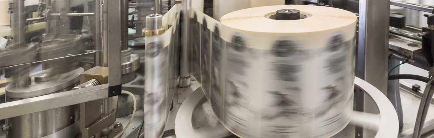 Labels being printed on a printing press.
