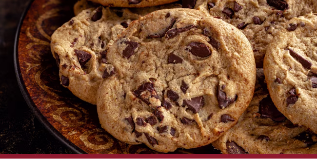 Closeup of chocolate chip cookies on a plate.