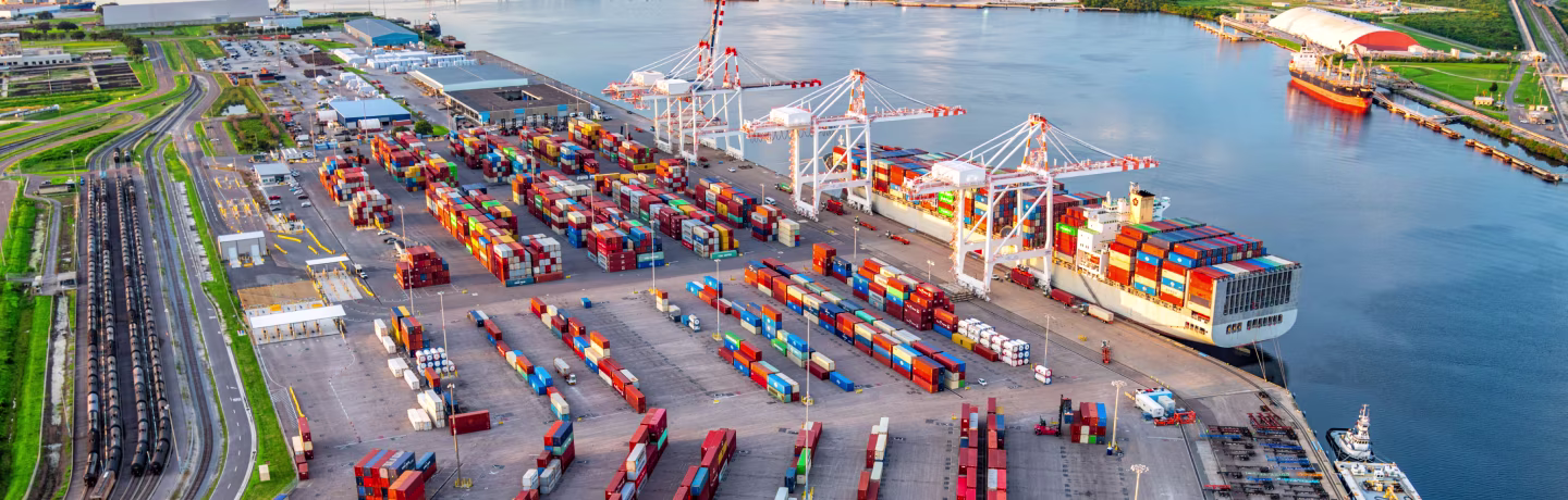 A fully loaded container ship in moored at the commercial docks of the Port of Tampa Bay located near downtown Tampa Florida shot via helicopter from an altitude of about 600 feet.