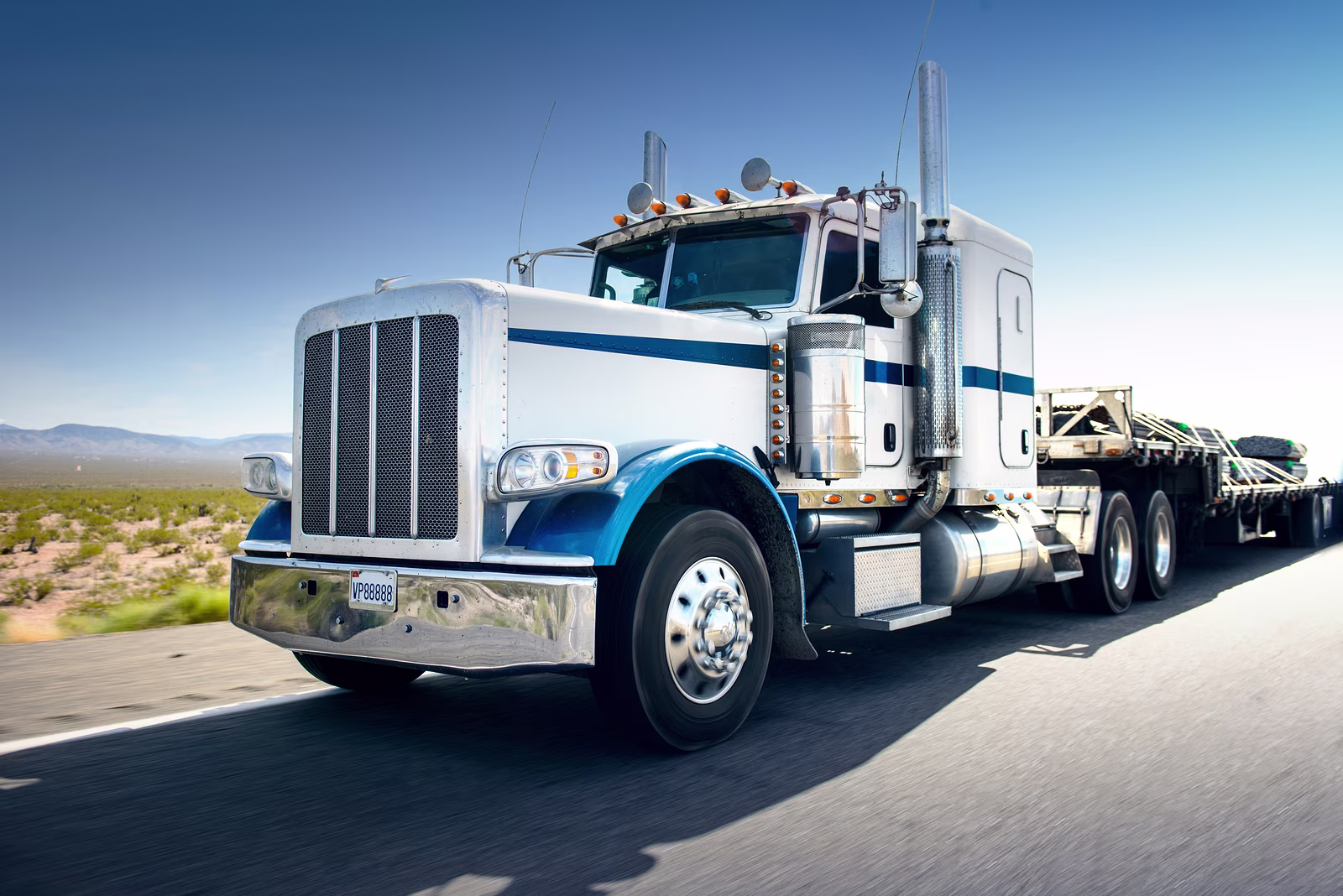 bigstock-truck-and-highway-at-day-tra-61492586.jpg