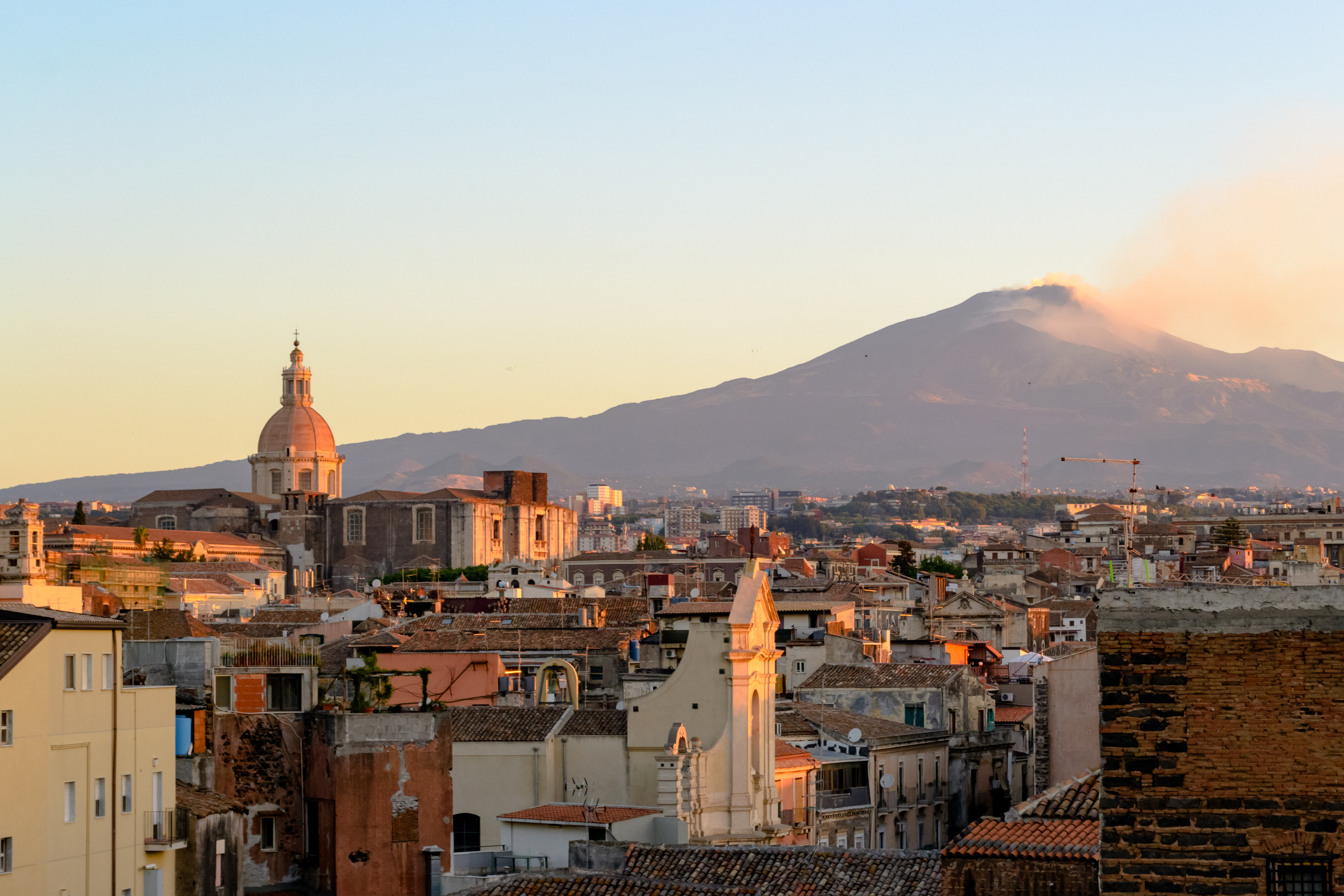 Catania, Sicily in Italy. Aerial view of the city roofs at dawn.