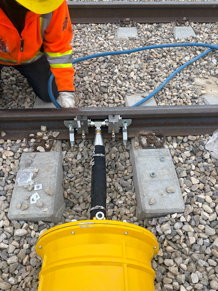 Mechanical grease applicator