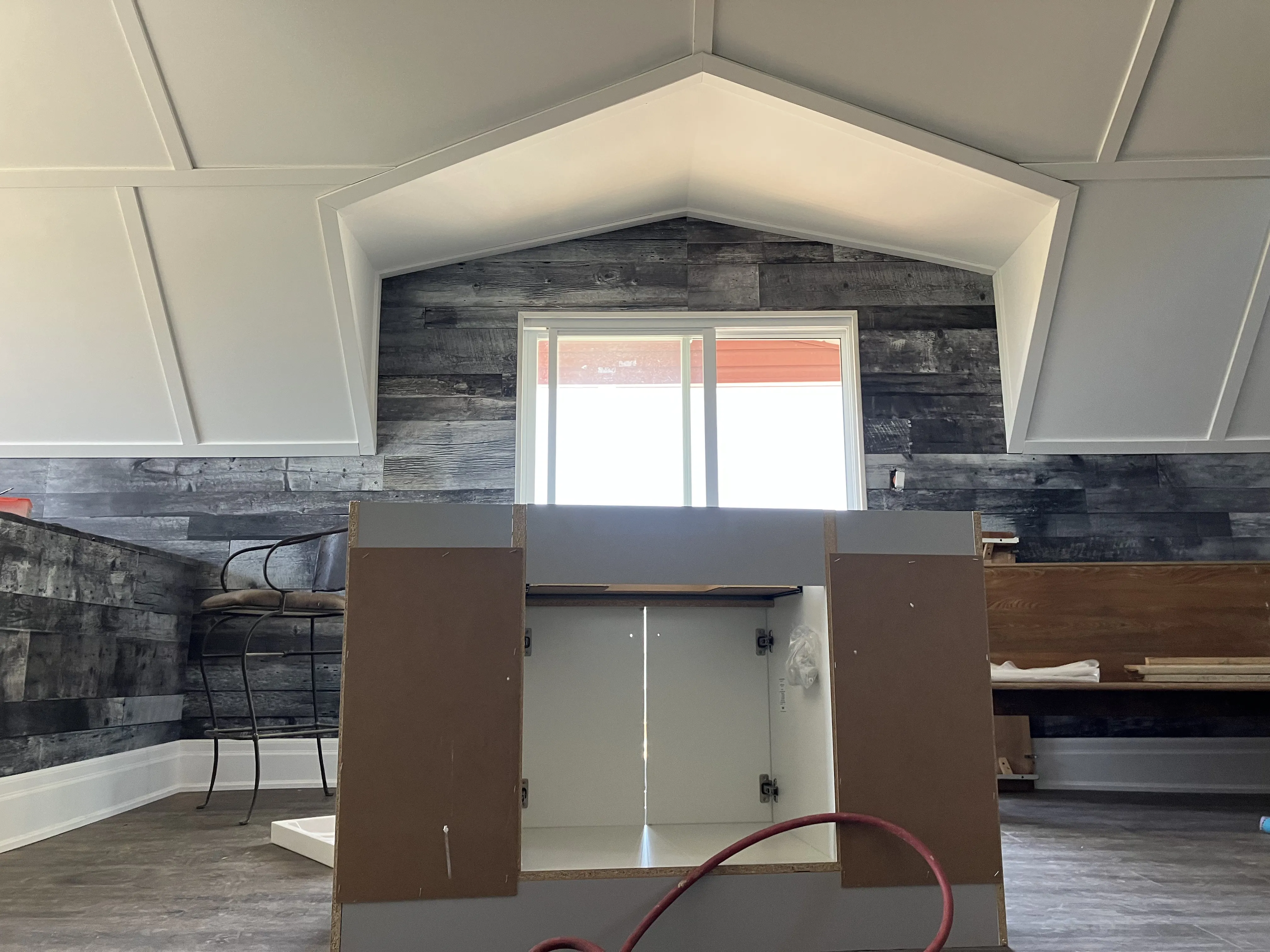 Kitchen renovation in Hamilton featuring new cabinets, backsplash installation, counters, and updated lighting