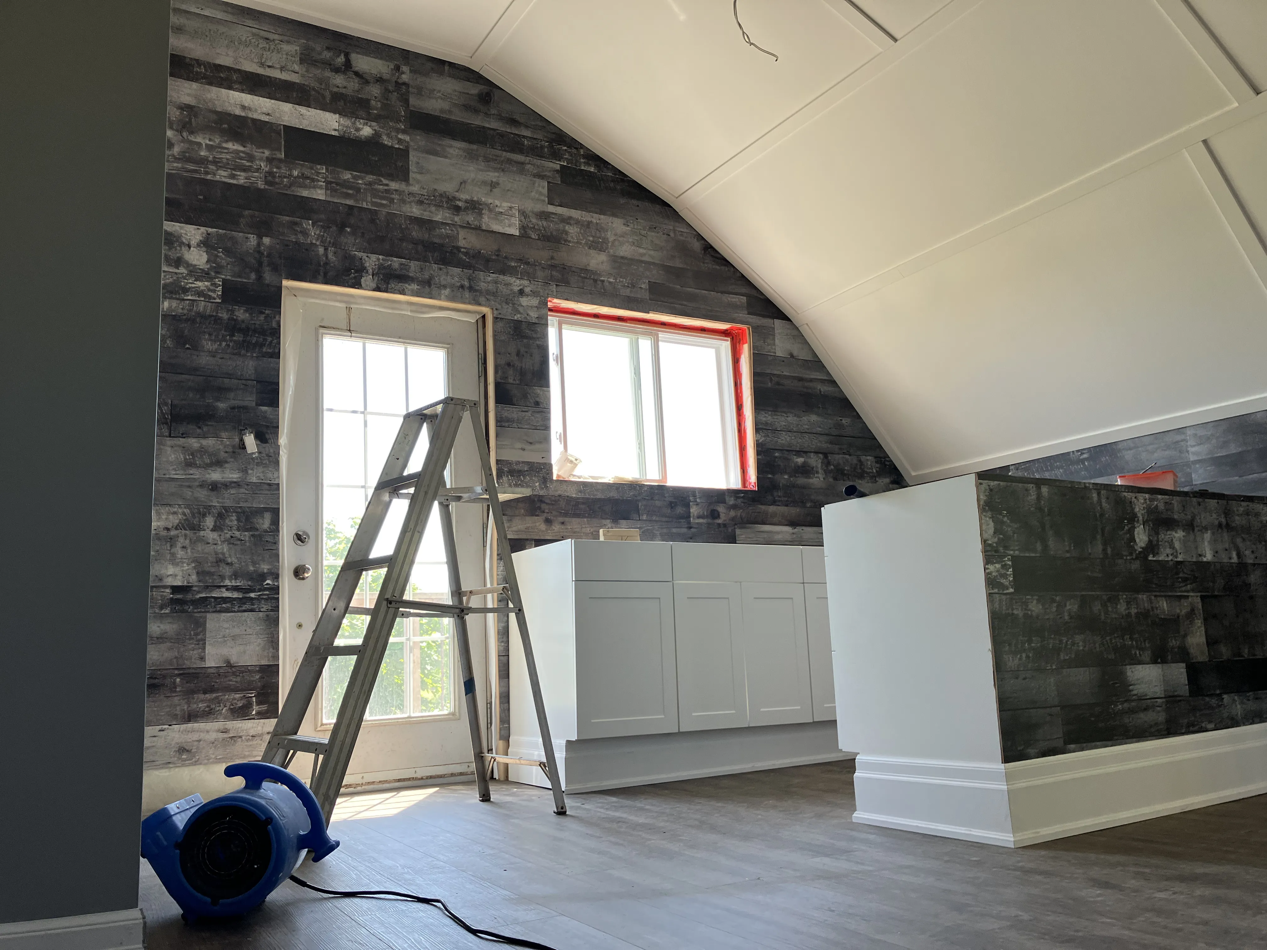 Laminate and vinyl flooring installation project in a Mississauga home with precise cuts and seamless edges