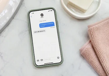 Phone screen showing a text conversation asking "Do tampons break the hymen?"