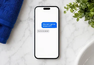 Text conversation answering "Why can't I get my tampon in?" with a reassuring "You're not alone!"