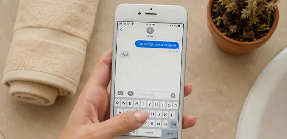 Phone screen showing a text conversation confirming that a virgin can use a tampax tampon