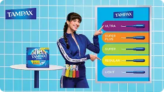 Woman pointing to a chart of five Tampax tampon absorbencies, Light, Regular, Super, Super Plus and Ultra, next to a Tampax Pearl pack
