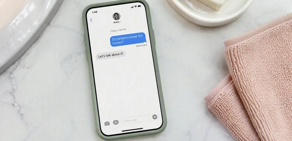 Phone screen showing a text conversation asking "Do tampons break the hymen?" 