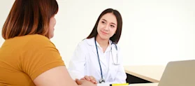 Female doctor perform treatment and examine symptoms of a female patient