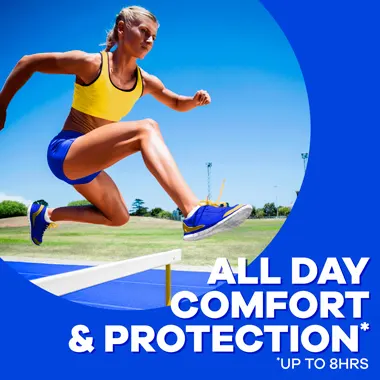 Tampax Tampons offer all day comfort and protection for up to 8 hours. Woman jumping over hurdle while running.