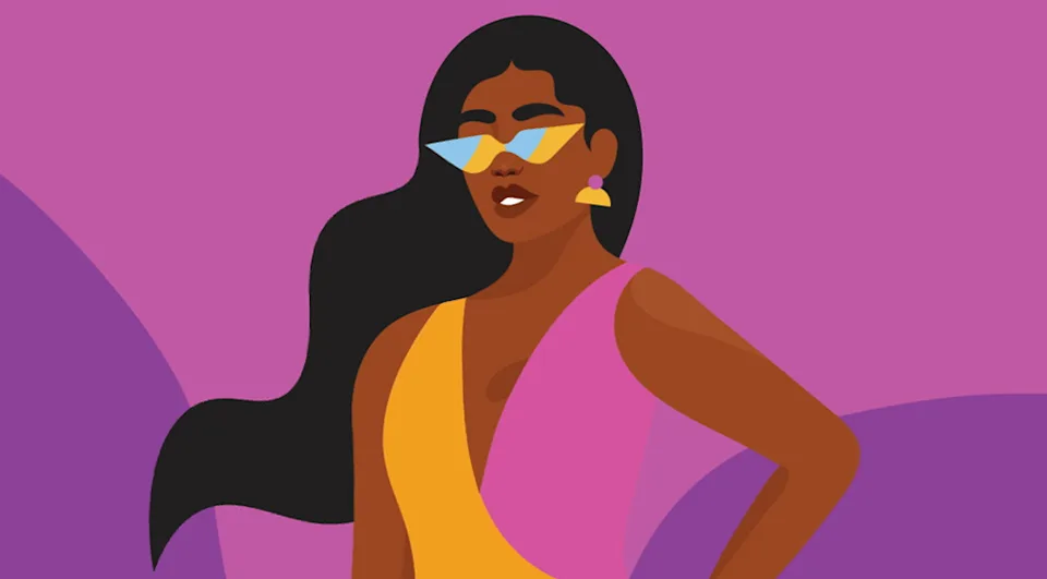 A woman in a colorful dress with sunglasses.