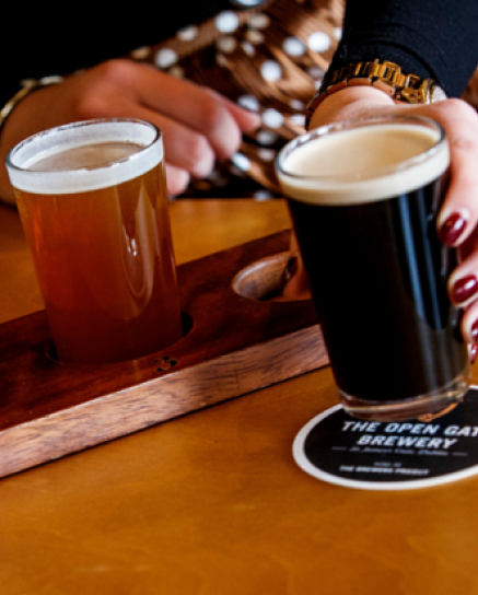 Photo with a board for beer flight with two beers on it