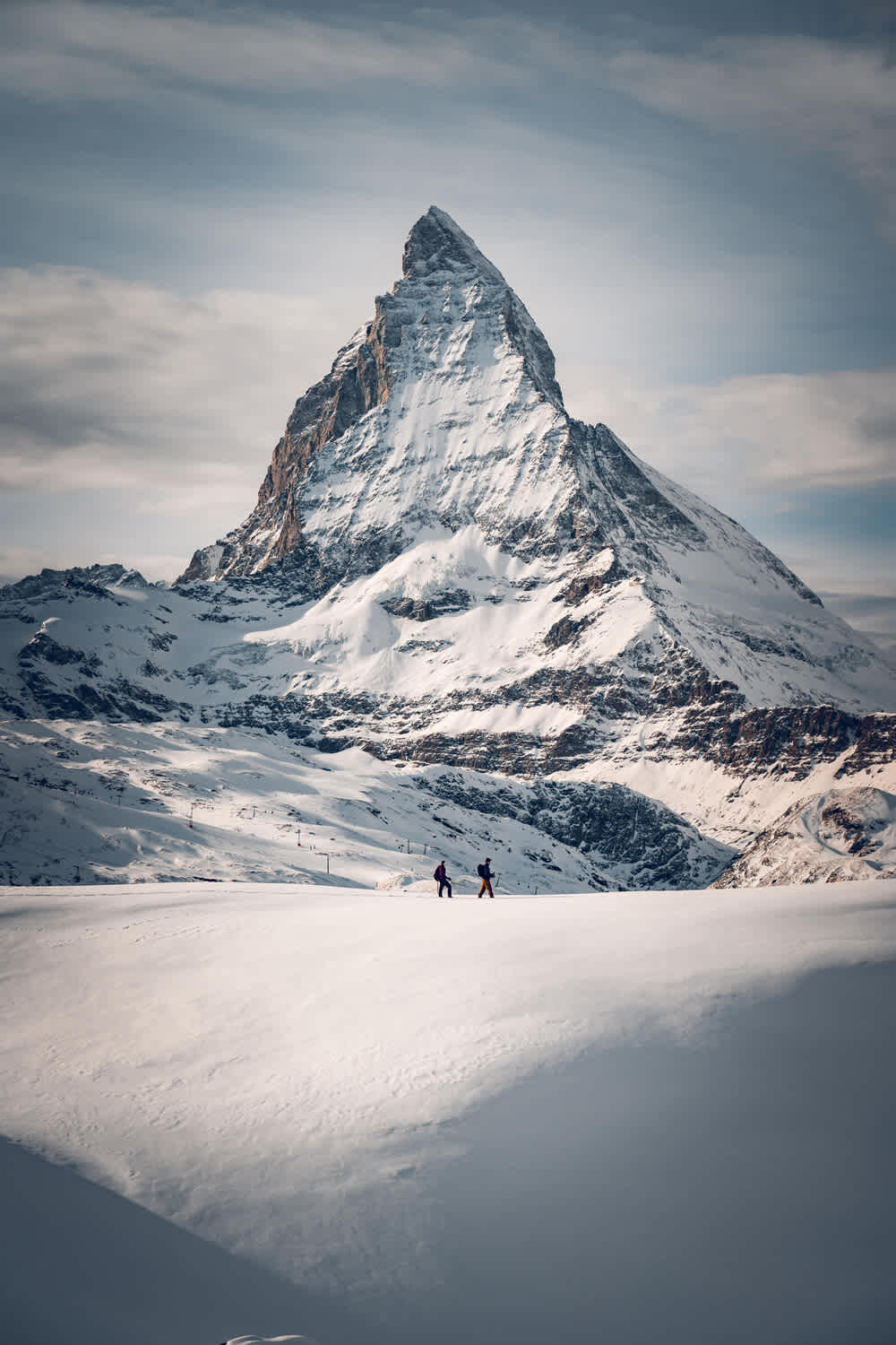 People snowshoing on the Panorama Trail at the Gornergrat with the Matterhorn in the background, Zermatt, Schweiz