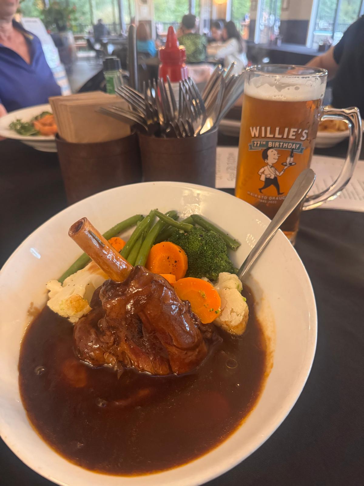 The Tomo A plate of lamb and gravy with a beer at The Tomo in Waitomo.