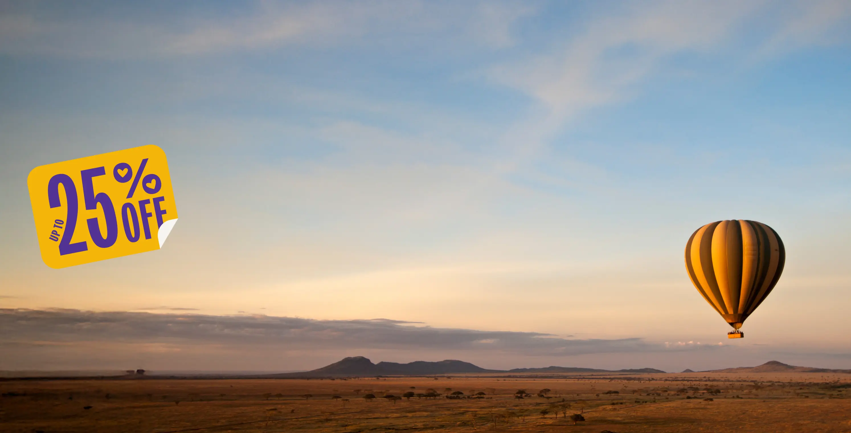 Hot air balloon floating over desert landscape at sunset with yellow "25% OFF" promotional badge in corner.