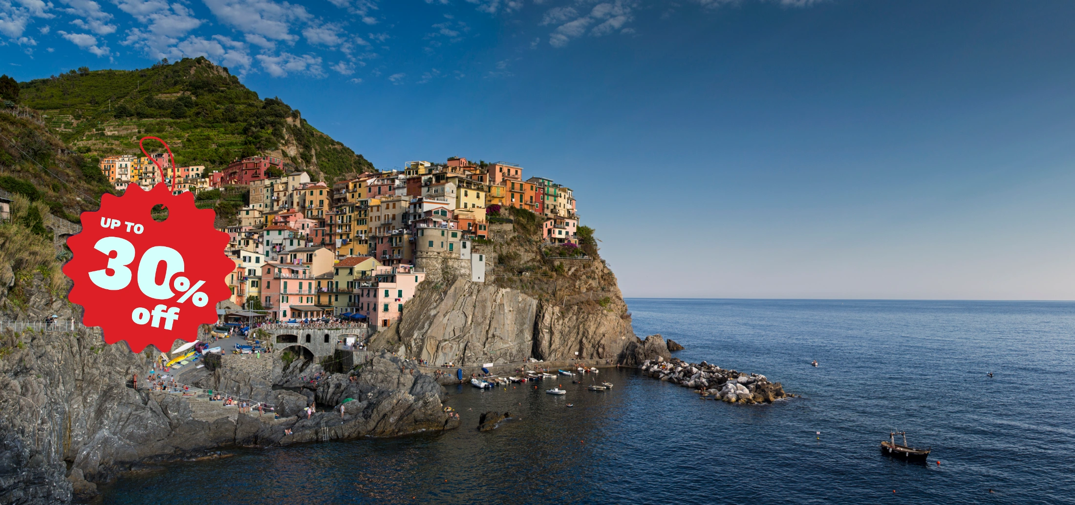 Colorful cliffside village of Cinque Terre, Italy, overlooking blue sea, with a red sale tag showing up to 30% off.