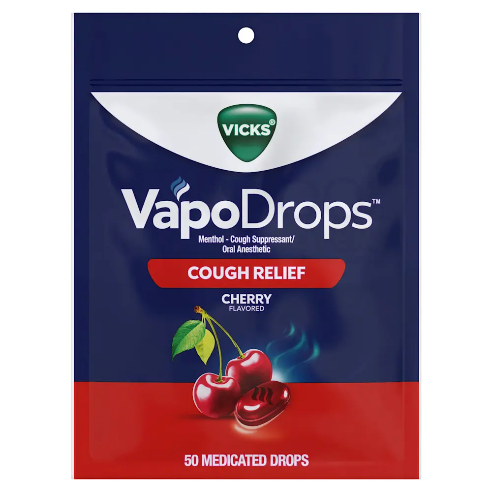 Fresh cherries with green leaves and a red candy against a blue background, labeled "CHERRY FLAVORED"
