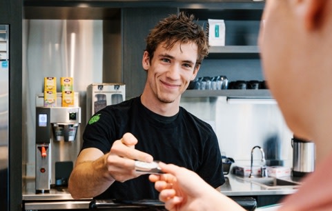 Man receiving money from a customer